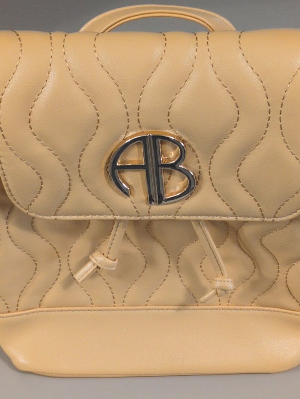 Alexis Bendel Women’s Beige Quilted Drawstring Backpack Purse, Adjustable Straps